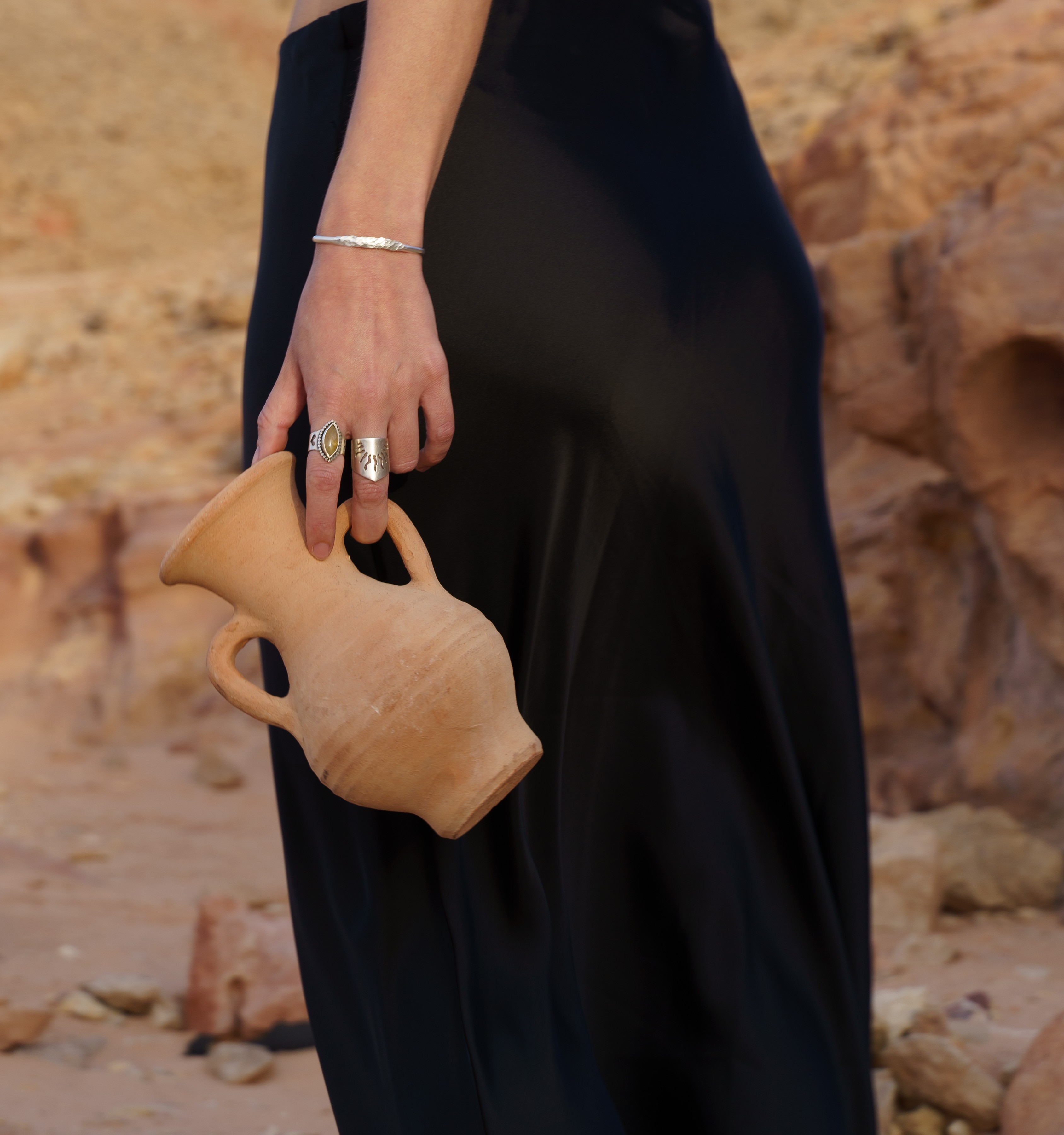 Handmade gold rings on weathered stone